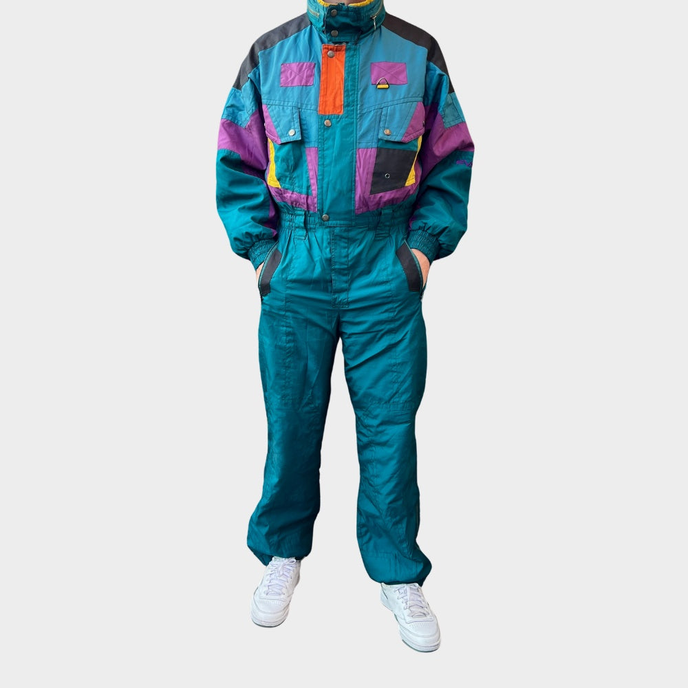 Vintage retro skisuit, ski-pak en skioverall jaren '80/'90, felgekleurde retro après-ski outfit voor carnaval 🎭, foute feestoutfit 🎿 en wintersport bij Retroskipakken.nl