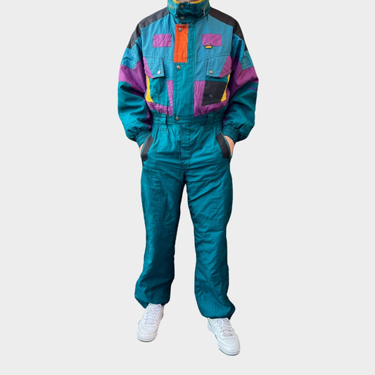 Vintage retro skisuit, ski-pak en skioverall jaren '80/'90, felgekleurde retro après-ski outfit voor carnaval 🎭, foute feestoutfit 🎿 en wintersport bij Retroskipakken.nl