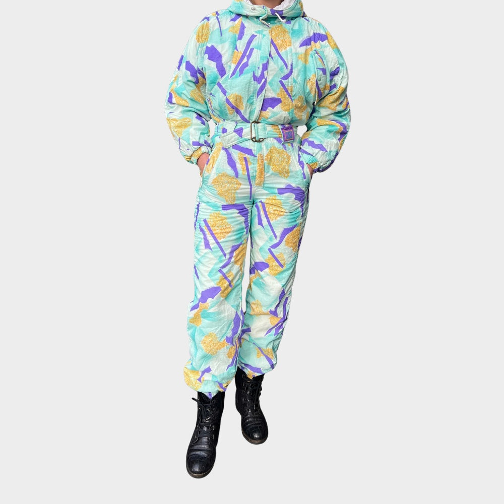 Vintage retro skisuit, ski-pak en skioverall jaren '80/'90, felgekleurde retro après-ski outfit voor carnaval 🎭, foute feestoutfit 🎿 en wintersport bij Retroskipakken.nl