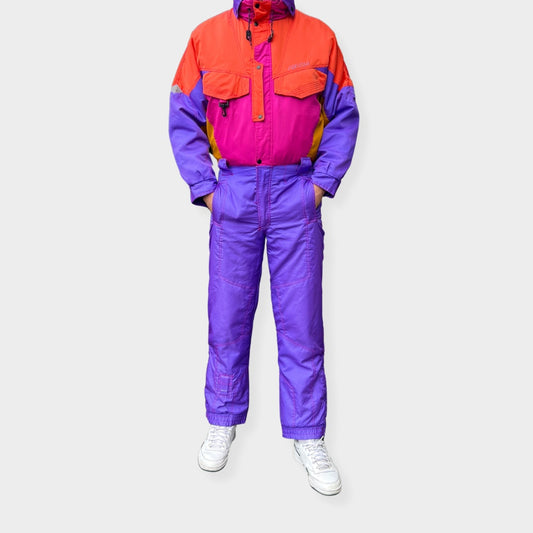 Vintage retro skisuit, ski-pak en skioverall jaren '80/'90, felgekleurde retro après-ski outfit voor carnaval 🎭, foute feestoutfit 🎿 en wintersport bij Retroskipakken.nl