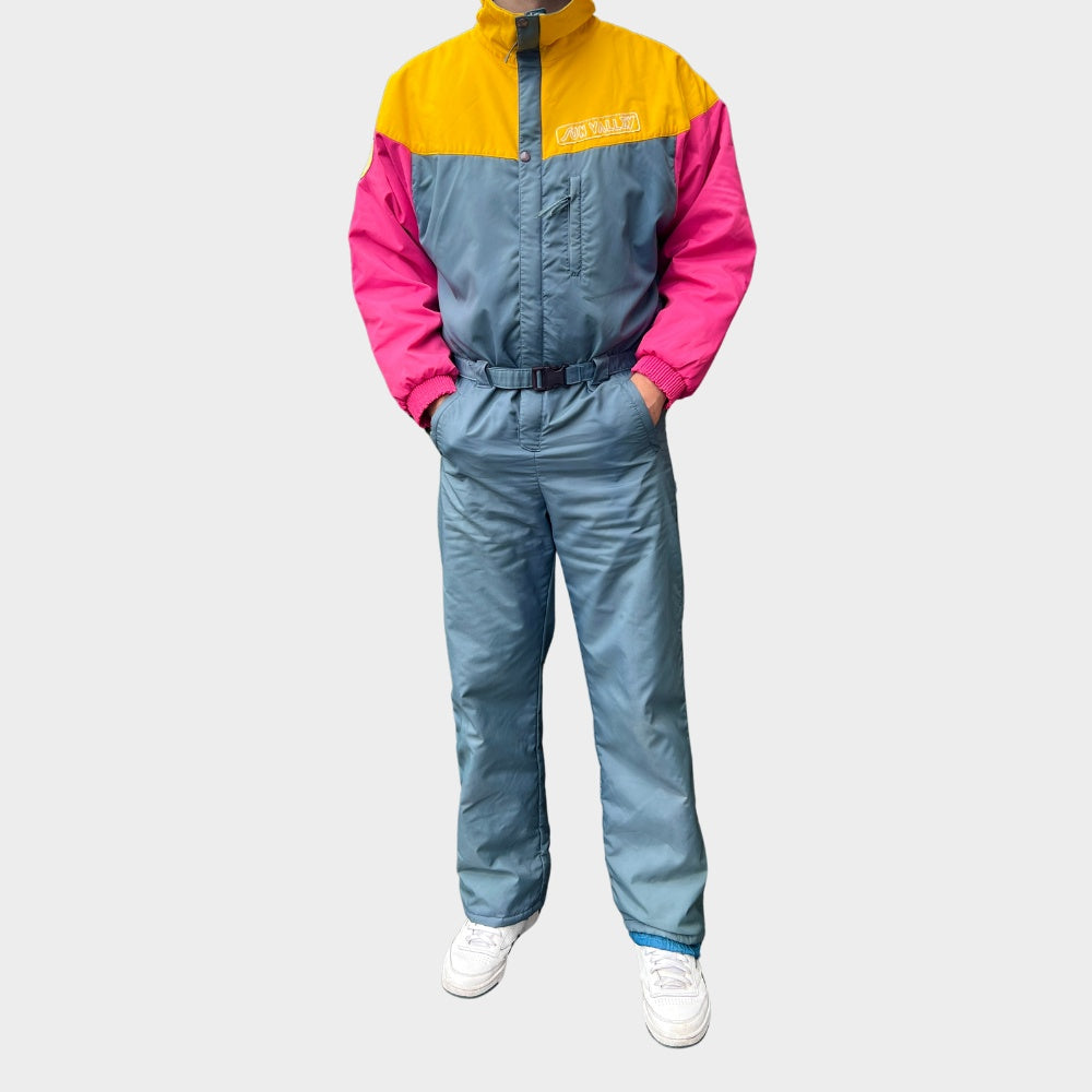 Vintage retro skisuit, ski-pak en skioverall jaren '80/'90, felgekleurde retro après-ski outfit voor carnaval 🎭, foute feestoutfit 🎿 en wintersport bij Retroskipakken.nl