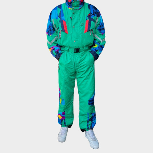 Vintage retro skisuit, ski-pak en skioverall jaren '80/'90, felgekleurde retro après-ski outfit voor carnaval 🎭, foute feestoutfit 🎿 en wintersport bij Retroskipakken.nl